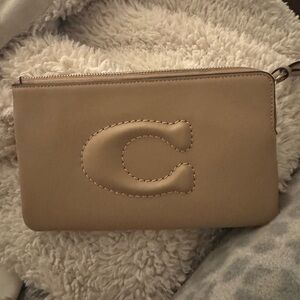 Coach Tan Leather Clutch with Embossed C Design